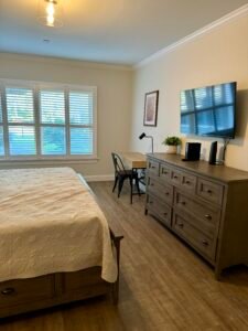 Bedroom at Cranmore Mountain Resort Airbnb with a cozy bed and a desk area.