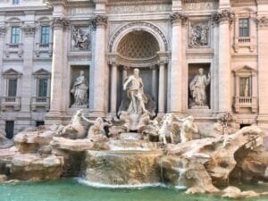 The iconic Trevi Fountain in Rome, Italy, with sculptures and cascading water.