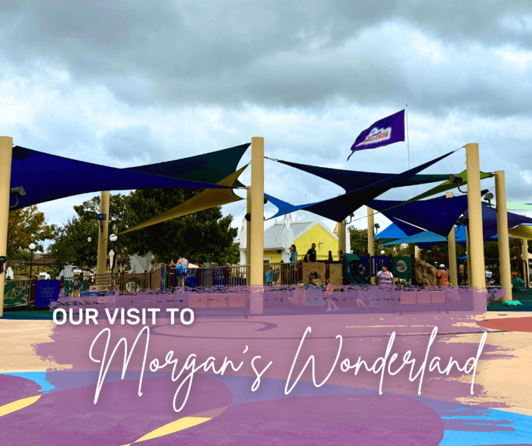 Entrance to Morgan’s Wonderland with colorful canopies and a sign welcoming visitors to the accessible theme park.